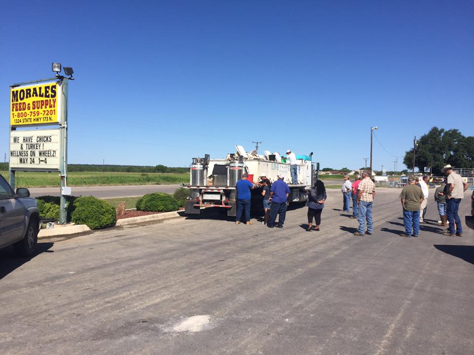 fish truck at a feed store people waiting for the fish truck